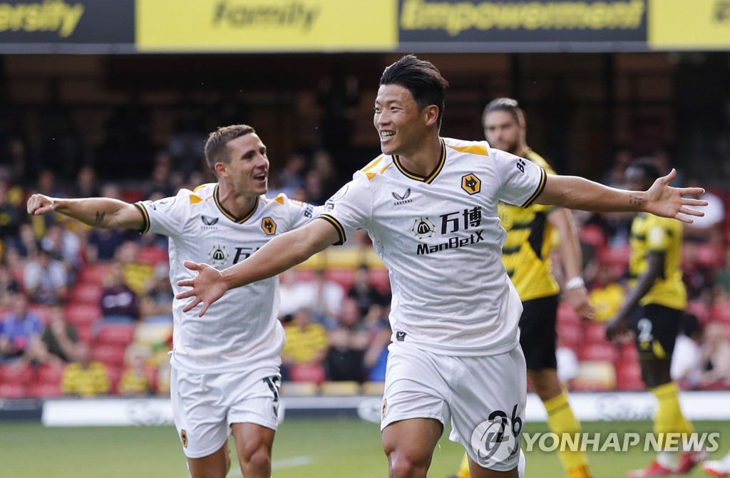 In this Action Images photo via Reuters, Hwang Hee-chan of Wolverhampton Wanderers (R) celebrates his goal against Watford in a Premier League match at Vicarage Road in Watford, England, on Sept. 11, 2021. (Yonhap)