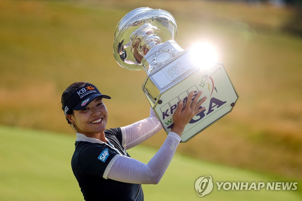 In this June 26, 2022, file photo from USA Today Sports via Reuters, Chun In-gee of South Korea holds the champion's trophy after winning the KPMG Women's PGA Championship at the Congressional Country Club's Blue Course in Bethesda, Maryland. (Yonhap)