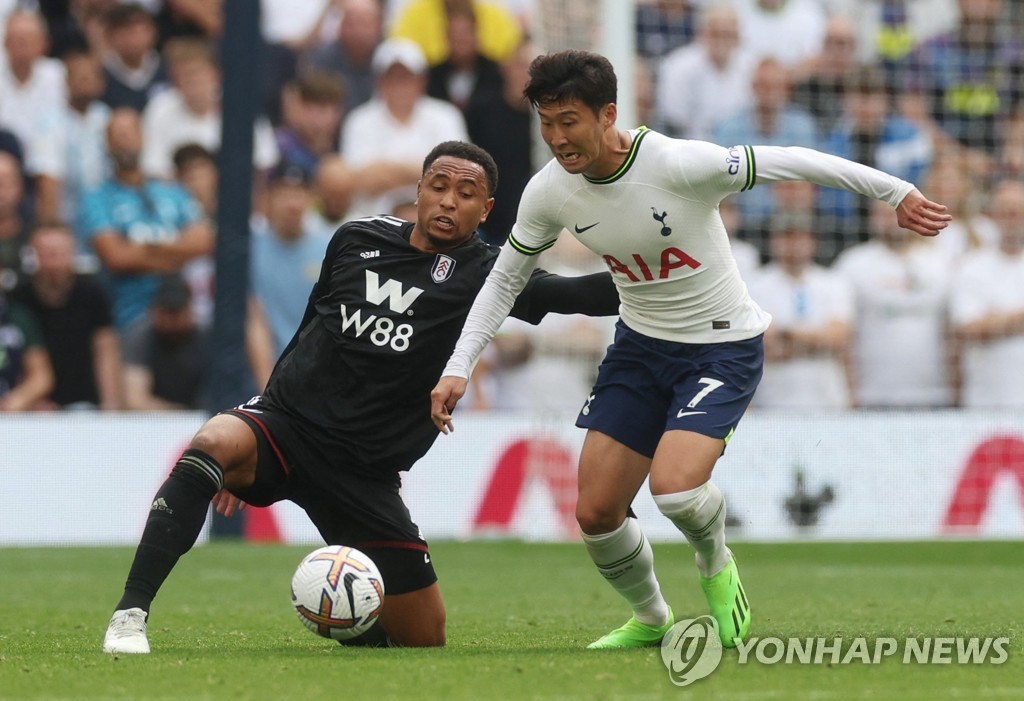 In this Action Images photo via Reuters, Son Heung-min of Tottenham Hotspur (R) tries to hold off Kenny Tete of Fulham FC during the clubs' Premier League match at Tottenham Hotspur Stadium in London on Sept. 3, 2022. (Yonhap)