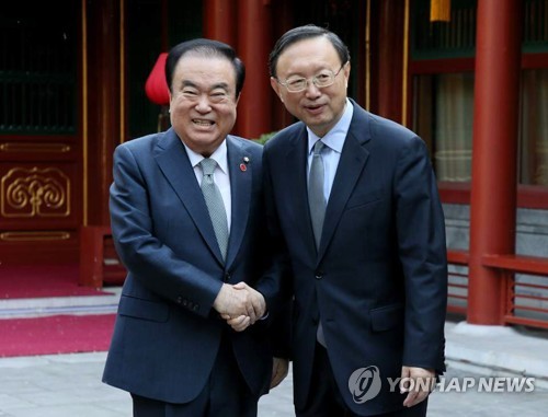 Speaker with senior Chinese official