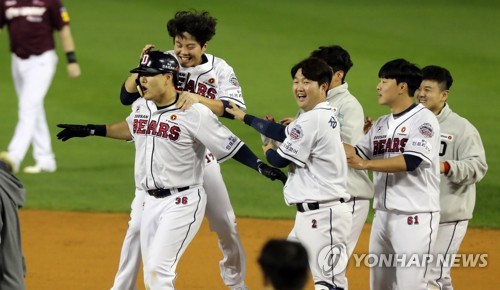 Catcher Park Sei-Hyok of Doosan Bears celebrates after hitting a