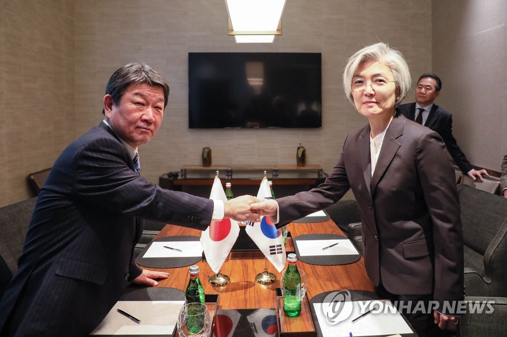 Top diplomats of S. Korea, Japan discuss row over history, trade