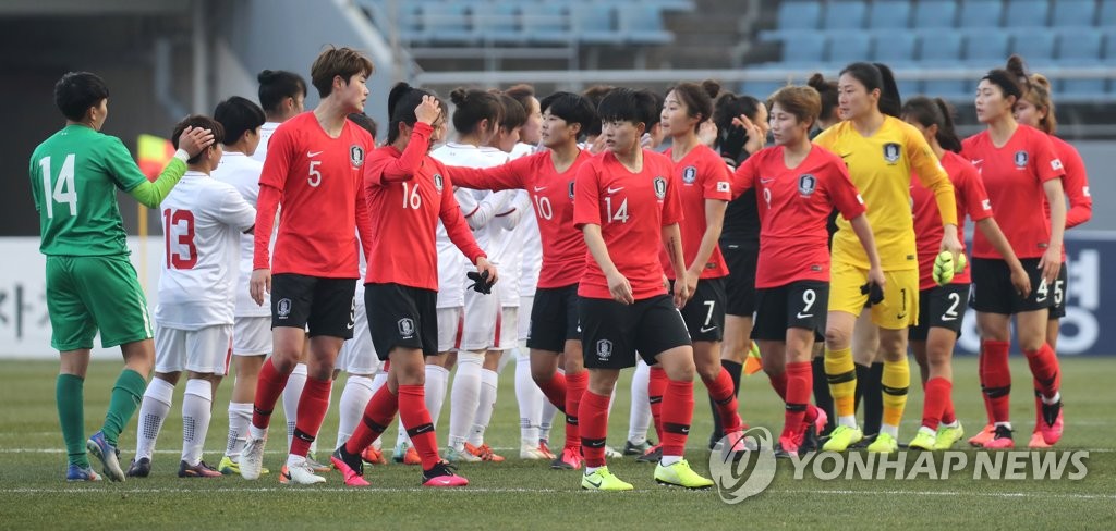 In this file photo from Feb. 9, 2020, South Korean players (in red and yellow) celebrate their 3-0 victory over Vietnam in their Group A match in the third round of the Asian qualifying for the 2020 Tokyo Olympics at Jeju World Cup Stadium in Seogwipo, Jeju Island. (Yonhap)