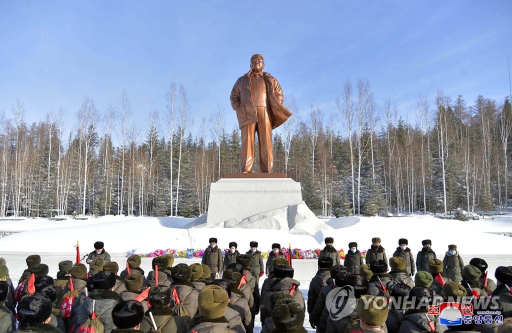 In this photo released by North Korea's Korean Central News Agency, officials of the Presidium of the Supreme People's Assembly gather in front of a statue of the North's late leader Kim Jong-il in Samjiyon at the foot of Mount Paektu in northern North Korea on Feb. 23, 2020, as they started an expedition to revolutionary battle sites around the mountain. (For Use Only in the Republic of Korea. No Redistribution) (Yonhap)