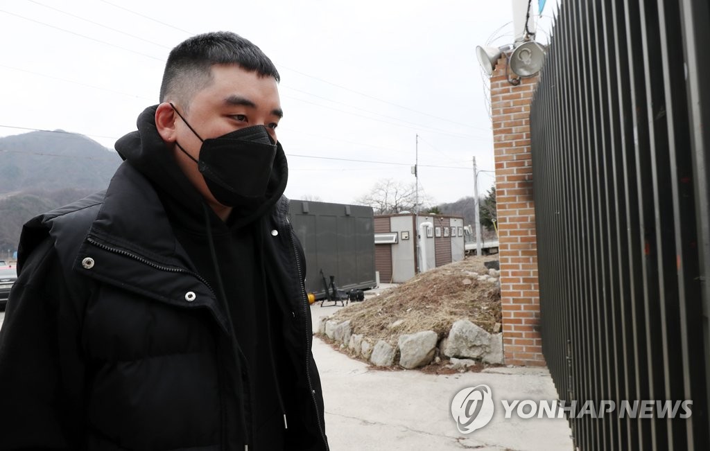 This March 9, 2020, file photo shows Seungri, the disgraced former member of K-pop boy band BIGBANG, entering an Army training camp in Cheorwon, about 90 kilometers northeast of Seoul.