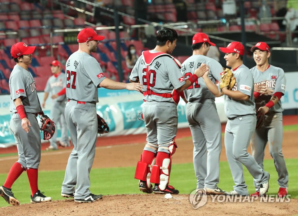 In this file photo from Aug. 12, 2020, SK Wyverns players celebrate their 11-2 victory over the KT Wiz in a Korea Baseball Organization regular season game at KT Wiz Park in Suwon, 45 kilometers south of Seoul. (Yonhap)
