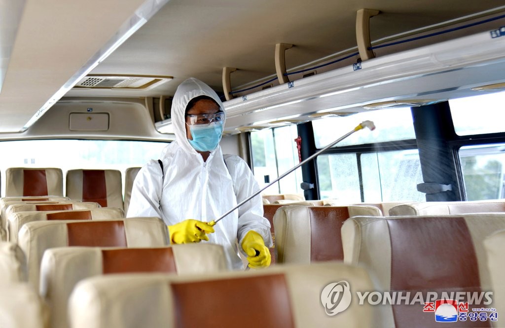In this undated file photo released by North Korea's official Korean Central News Agency on Sept. 4, 2020, an official disinfects a bus in Pyongyang amid the coronavirus pandemic. (For Use Only in the Republic of Korea. No Redistribution) (Yonhap)