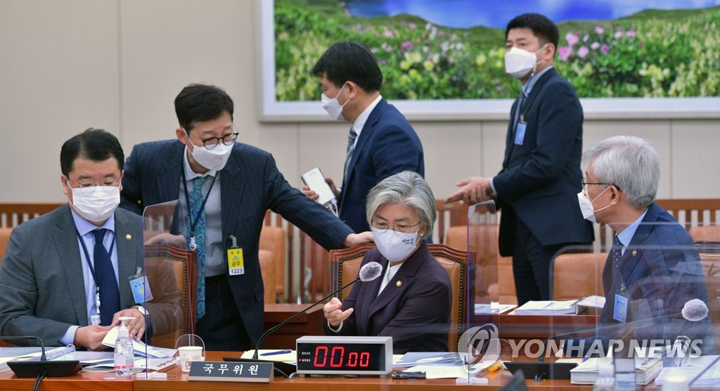 This file photo shows foreign ministry officials, including Foreign Minister Kang Kyung-wha (C, front row) and two vice foreign ministers, Choi Jong-kun (L) and Lee Tae-ho (R), at the National Assembly on Oct. 7, 2020. (Yonhap)