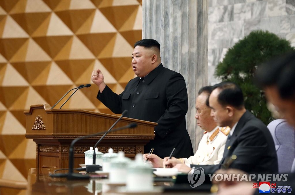 North Korean leader Kim Jong-un clenches his fist during the second plenary meeting of the central committee of the Workers' Party in Pyongyang on Feb. 8, 2021, in this photo released by Korean Central News Agency. The meeting included discussion of details to put into practice a new five-year economic development plan set forth at the party's eighth congress the previous month. (For Use Only in the Republic of Korea. No Redistribution) (Yonhap)