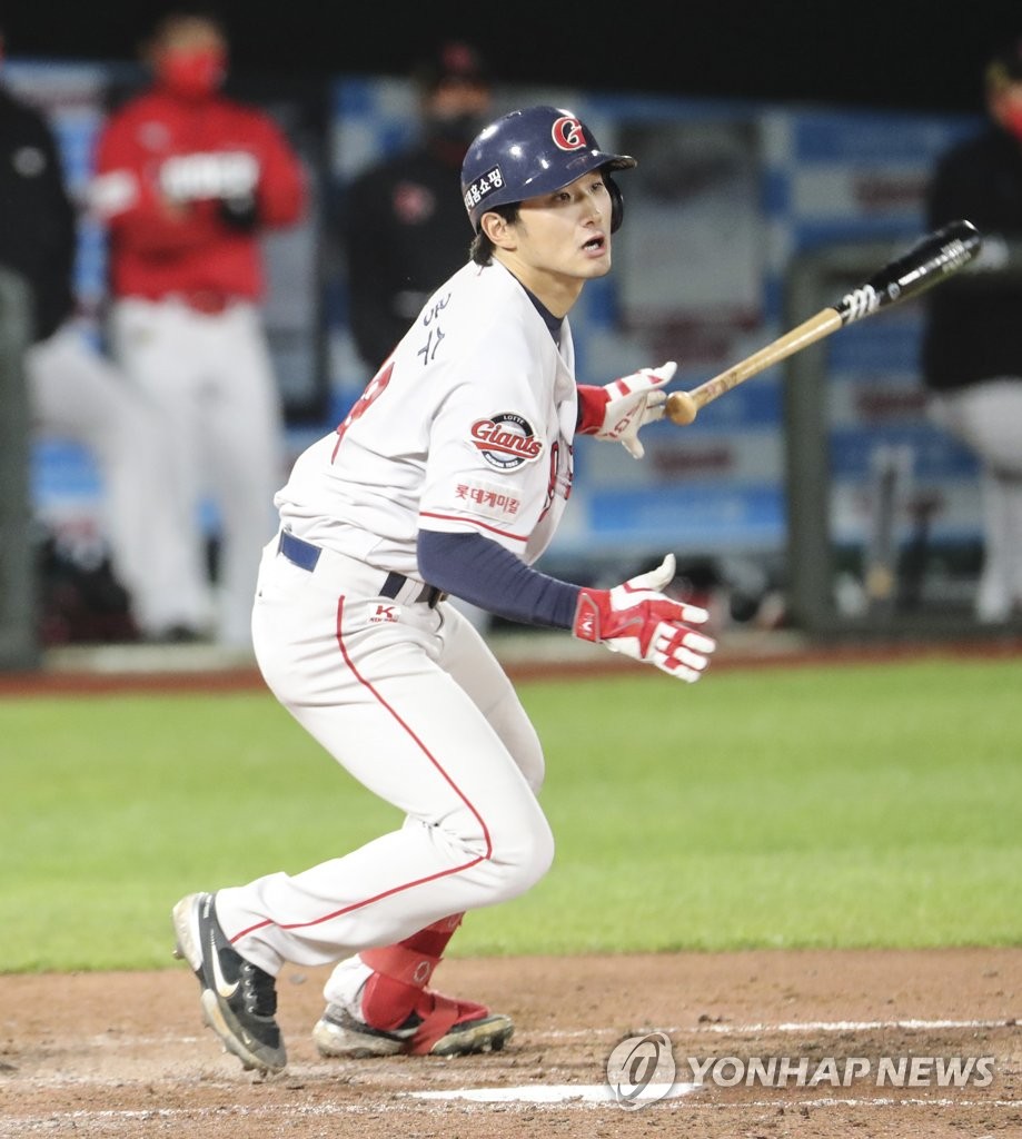 Shin Yong-su of the Lotte Giants hits an RBI double against the SSG Landers in the bottom of the fourth inning of a Korea Baseball Organization regular season game at Sajik Stadium in Busan, 450 kilometers southeast of Seoul, on May 11, 2021. (Yonhap)