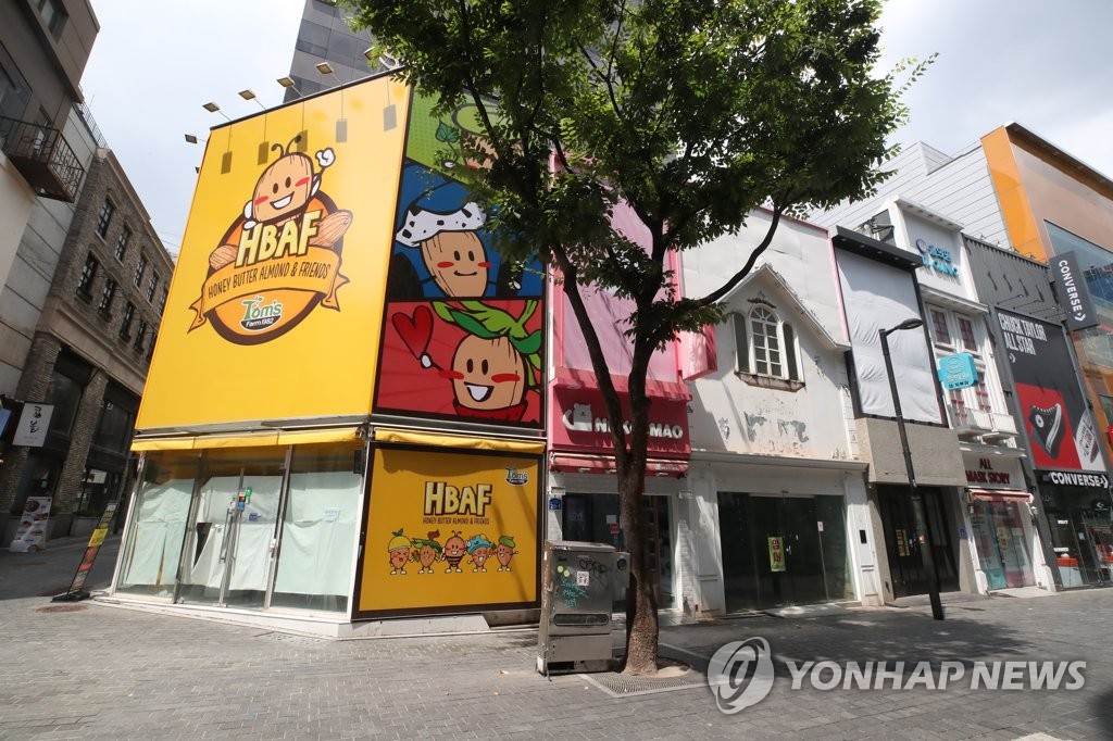 This photo, taken Aug. 6, 2021, shows stores with "For Lease" signs in the shopping district of Myeongdong in central Seoul. (Yonhap)