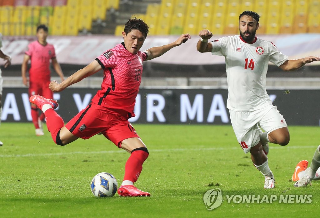 In this file photo, Lee Dong-gyeong of South Korea (L) attempts a shot against Lebanon during the teams' Group A match in the final Asian qualifying round for the 2022 FIFA World Cup at Suwon World Cup Stadium in Suwon, Gyeonggi Province, on Sept. 7, 2021. (Yonhap)