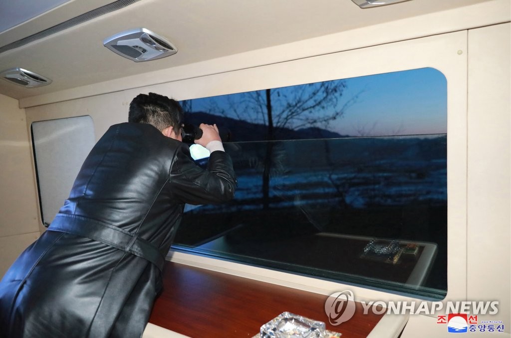 North Korean leader Kim Jong-un watches what the North claims to be a new hypersonic missile being launched on Jan. 11, 2022, in this photo released by North Korea's official Korean Central News Agency the next day. Kim "appreciated the practical achievements" made by those involved in research related to the missile development. South Korea's defense ministry said the previous day the North fired what appeared to be a ballistic missile into the East Sea. (For Use Only in the Republic of Korea. No Redistribution) (Yonhap)