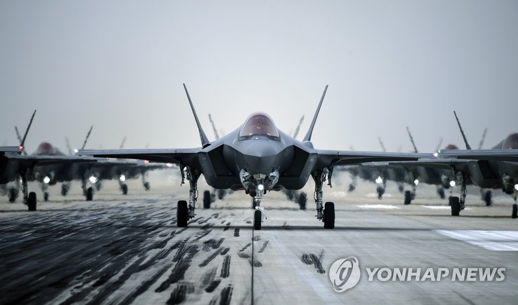 This file photo, provided by the defense ministry, shows the South Korean Air Force's F-35A stealth fighters performing an elephant walk under the command of Defense Minister Suh Wook at an unidentified air base on March 25, 2022, to show the country's combat readiness following North Korea's intercontinental ballistic missile (ICBM) test the previous day. (PHOTO NOT FOR SALE) (Yonhap)