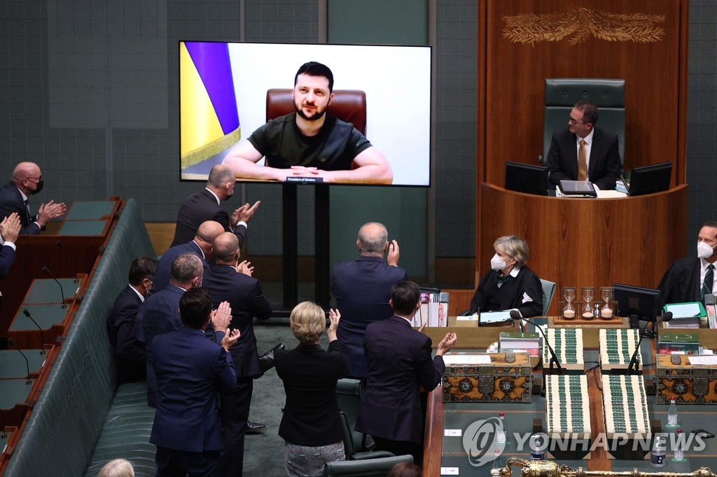 In this AFP photo, Ukrainian President Volodymyr Zelenskyy addresses the Parliament of Australia in Canberra on March 31, 2022. (Yonhap)