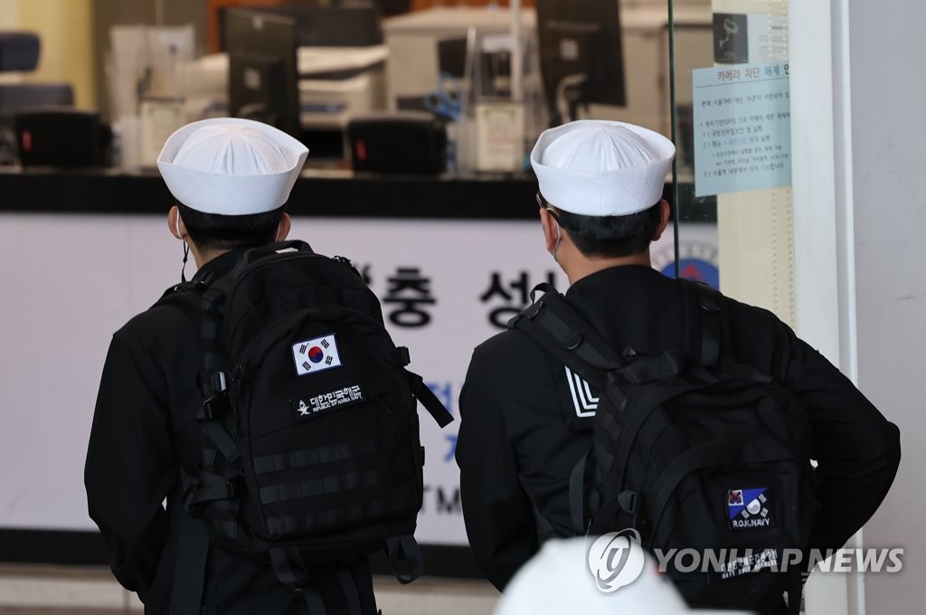 In this file photo, service members walk at Seoul Station in central Seoul on May 1, 2022. (Yonhap)