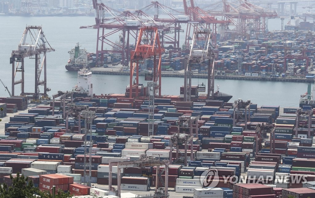This file photo, taken May 23, 2022, shows stacks of containers at a port in South Korea's southeastern city of Busan. (Yonhap)