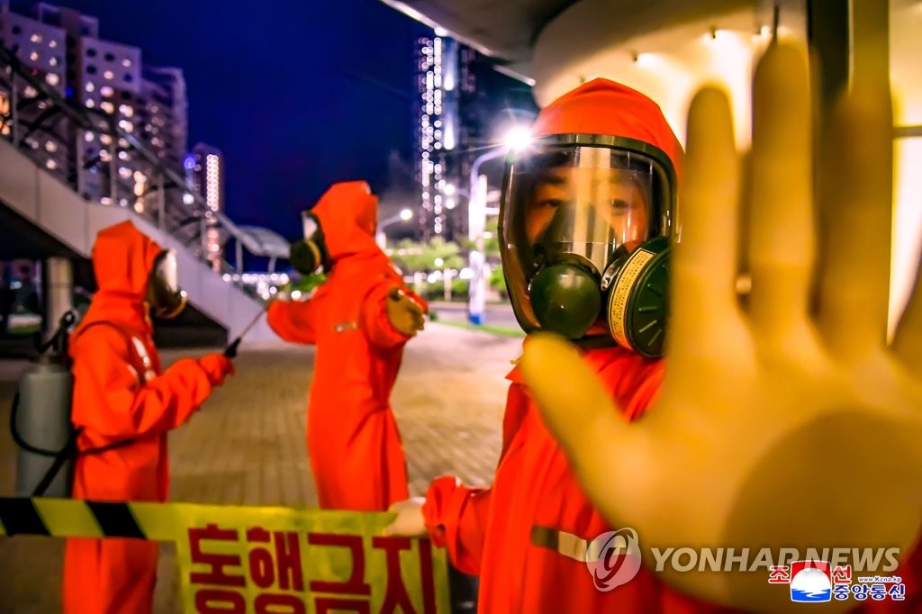 North Korean workers in protective gear carry out disinfection work in Pyongyang's Sadong District amid the COVID-19 outbreak, in this undated photo released by the official Korean Central News Agency on June 7, 2022. (For Use Only in the Republic of Korea. No Redistribution) (Yonhap)