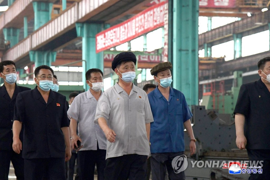 North Korea's Cabinet Premier Kim Tok-hun (C) visits a heavy machine factory, in this undated photo released by the North's Korean Central News Agency on July 12, 2022. (For Use Only in the Republic of Korea. No Redistribution) (Yonhap)