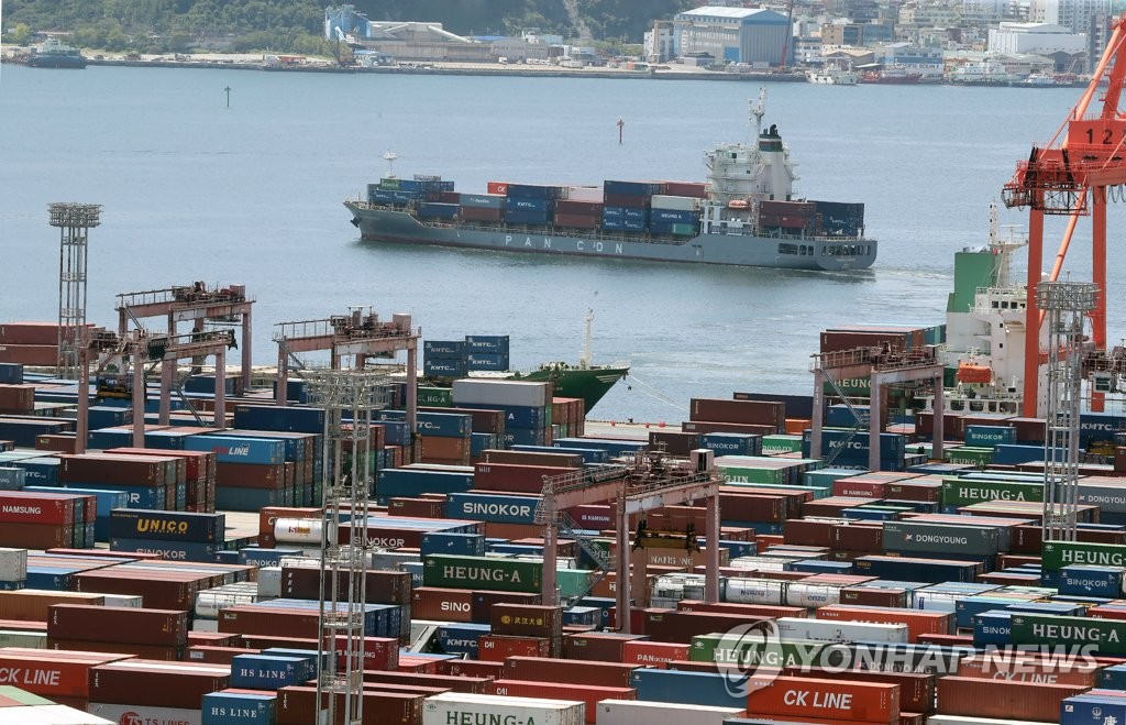 This file photo, taken Aug. 22, 2022, shows containers stacked at a pier in South Korea's southeastern port city of Busan. (Yonhap)