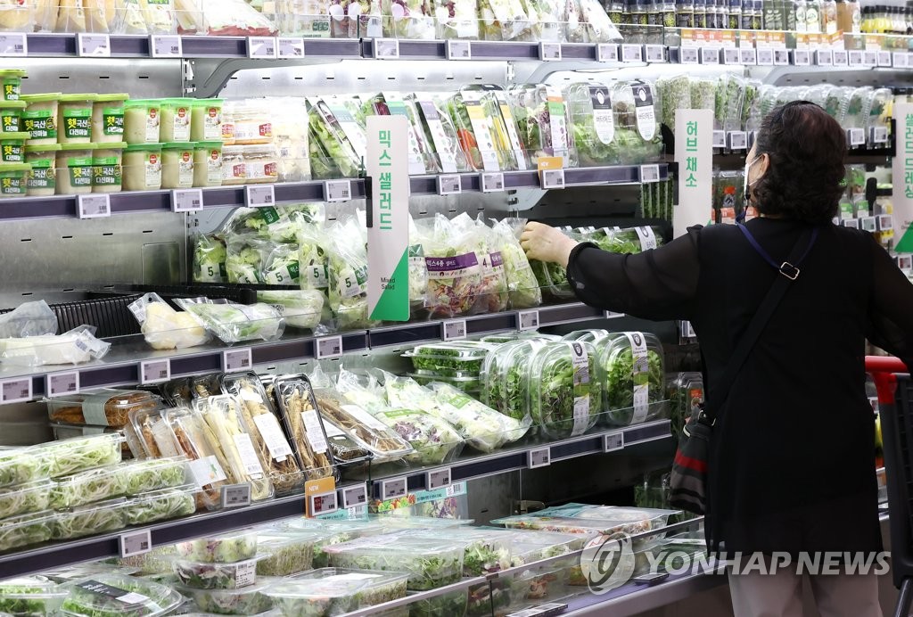 A citizen shops for groceries at a discount store in Seoul amid high inflation on Aug. 29, 2022.
