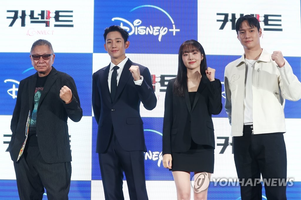 Director Takashi Miike (1st from L) and the main cast members of Disney+'s new Korean-language series "Connect" (from L: Jung Ha-in, Kim Hye-jun, Ko Kyoung-pyo) pose for photographers during a press conference to promote the series in Busan on Oct. 7, 2022. (Yonhap)