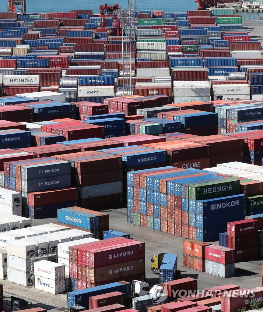 Containers for exports and imports are stacked at a pier in South Korea's largest port city of Busan on Oct. 11, 2022. South Korea's exports slipped 20.2 percent on-year in the first 10 days of October due mainly to sluggish overseas sales of chips, according to data from the Korea Customs Service. (Yonhap)