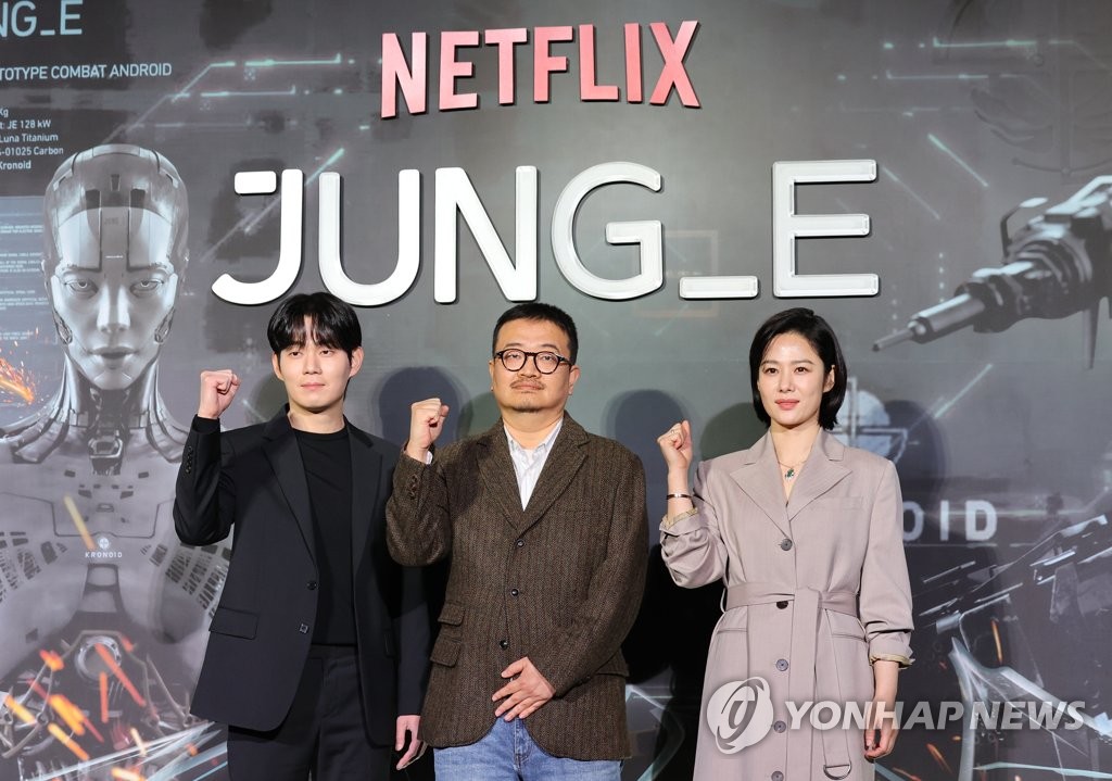 Actor Ryu Kyung-soo (L), director Yeon Sang-ho (C) and actress Kim Hyun-joo (R) pose for a photo during a promotional press event for the Netflix movie "Jung_E" in Seoul on Jan. 12, 2022. (Yonhap)