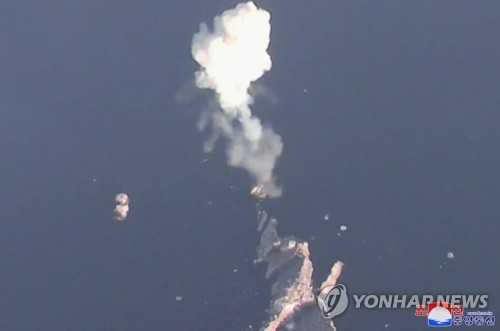 This photo, carried by the official Korean Central News Agency on March 28, 2023, shows the North conducting a demonstration education firing drill simulating tactical nuclear attacks involving the midair detonation of mock nuclear warheads. (For Use Only in the Republic of Korea. No Redistribution) (Yonhap)