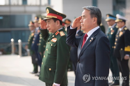South Korean Defense Minister Lee Jong-sup (R) and his Vietnamese counterpart, Phan Van Giang, inspect an honor guard prior to their talks at the defense ministry in Seoul on March 28, 2023, in this photo provided by the ministry. (PHOTO NOT FOR SALE) (Yonhap)
