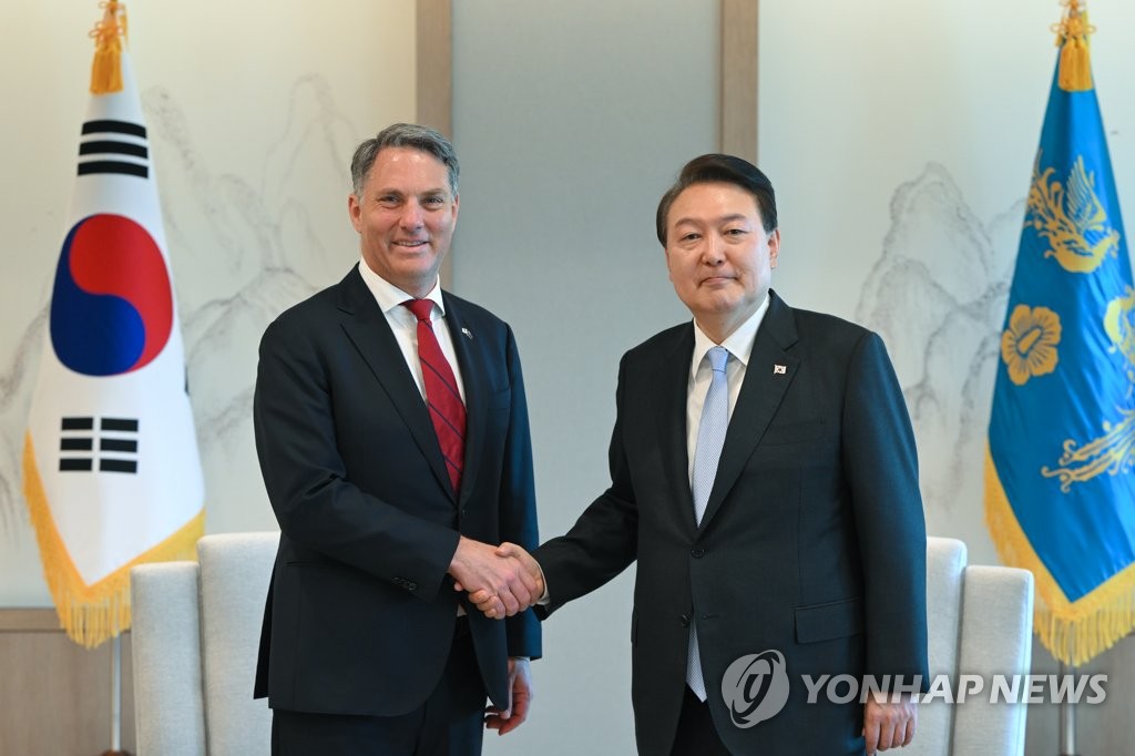 South Korean President Yoon Suk Yeol (Right) And Australian Deputy Prime Minister Richard Marles Shake Hands During A Meeting At The Presidential Office In Seoul On May 30, 2023.  (Photo Provided By Yoon'S Office. Not For Resale And Filing)
