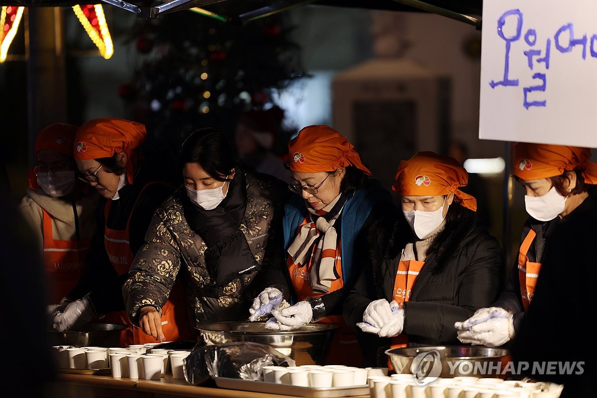 Members of an organization who lost their spouses and children to martial law troops during the 1980 pro-democracy movement prepare food to hand out to participants at a rally at the May 18 Democracy Square in Gwangju, about 270 kilometers south of Seoul, on Dec. 5, 2024, calling on President Yoon Suk Yeol to step down after his abrupt declaration and subsequent lifting of martial law earlier this week. (Yonhap)